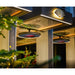 Bromic Eclipse Heaters acting as Modern outdoor lighting fixture with decorative elements at night