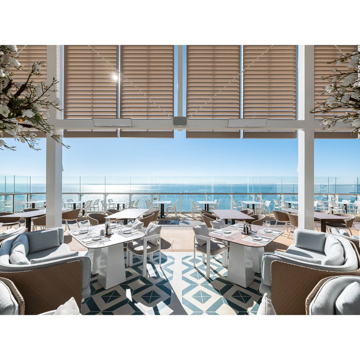 Modern outdoor dining area with ocean view