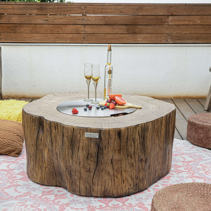 Wooden fire pit table with drinks and snacks on a patio setting