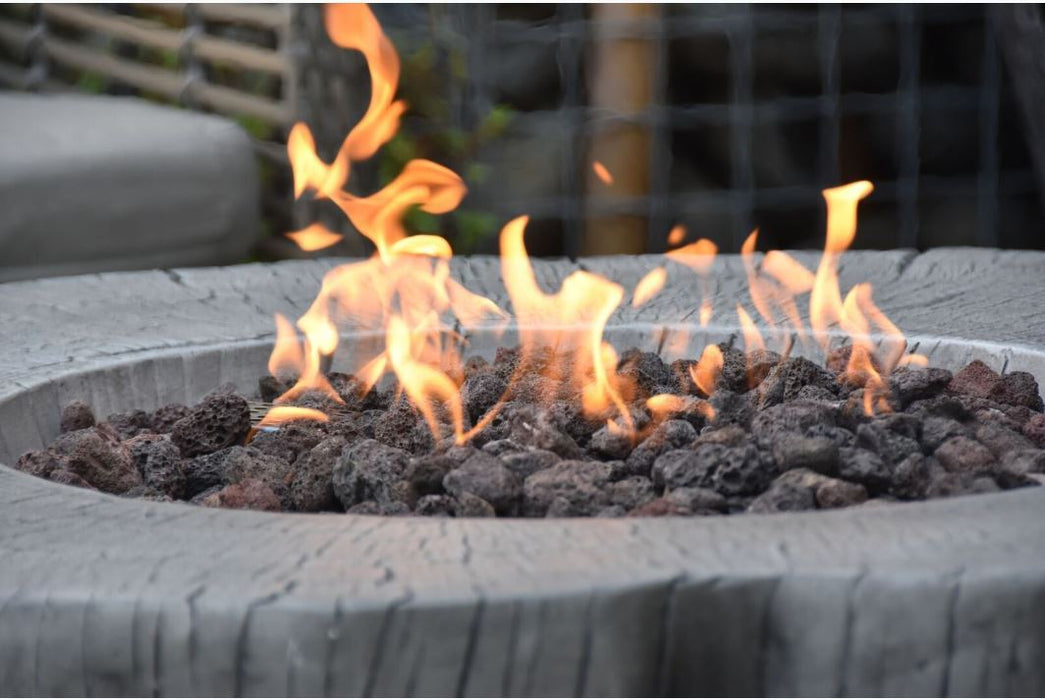 Fire pit with flames burning on a blurred background