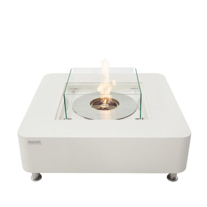 Cream White ethanol fire pit table with glass top on a white background