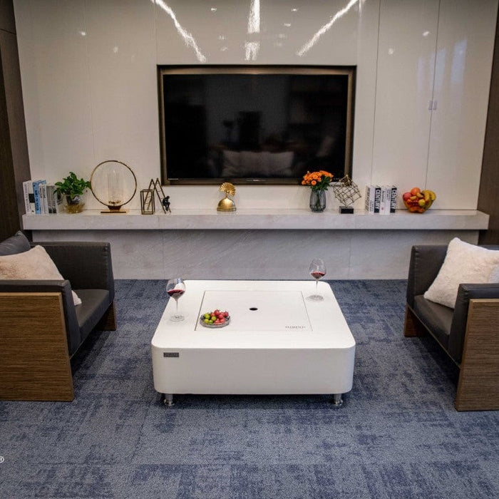 Modern living room with a fireplace, sofa, and coffee table.