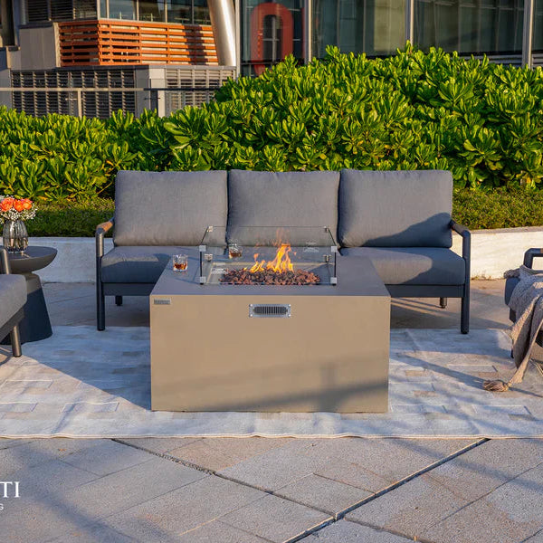 Outdoor patio setup with Rocky Propane fire pit table, chairs, and Elementi branding.