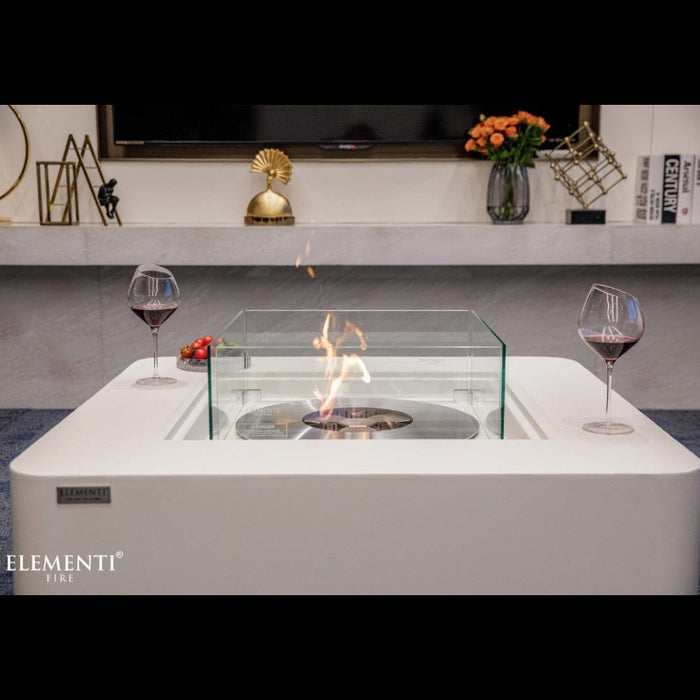 Modern fire pit table with glass top and Elementi Fire branding