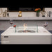 Modern fire pit table with glass top and Elementi Fire branding