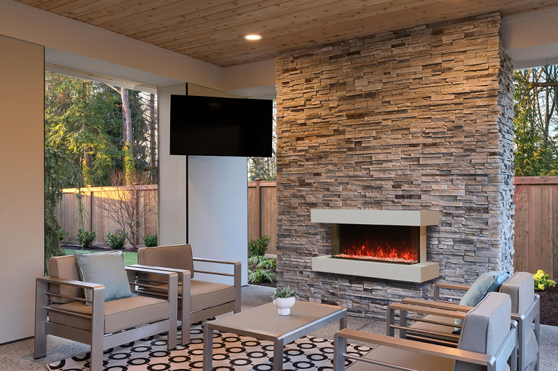 Landscape Pro Multi 44 inch by Modern Flames in a Studio Suite mantel on a stone wall under a covered patio