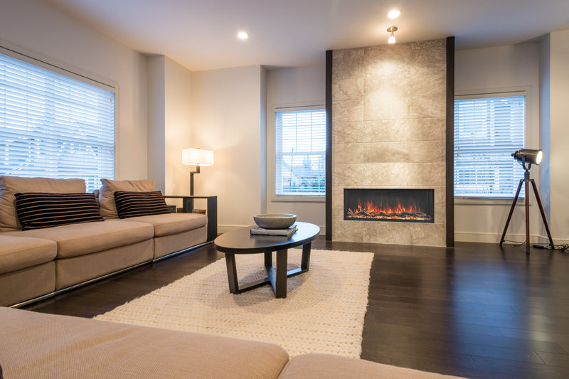 Modern Flames 44 inch Landscape Pro Multi built into a tiled living room wall with orange flames
