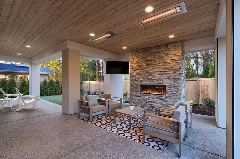 Modern Flames Landscape Pro Slim built into a stacked stone wall on a covered patio