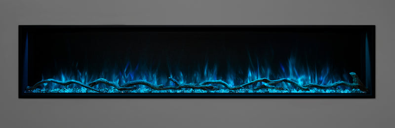 Blue flames and a blue ember bed on a Modern Flames Landscape Pro Slim fireplace