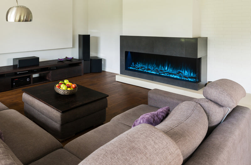 Modern Flames Landscape Pro 80 inch fireplace in a dark living room with a sectional