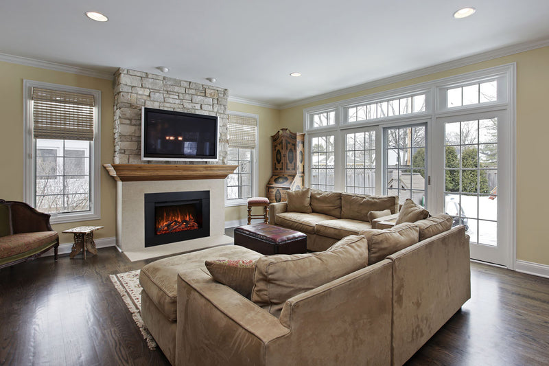 Redstone 36 electric fireplace built into a stone wall under a mounted TV and wood mantel