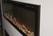 Angled view of the Modern Flames Spectrum Slimline trim, top touch controls and driftwood logs over orange embers