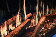 Modern Flames log set of charred TruWood timber logs with flames over a glass ember bed