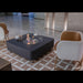 Modern Elementi ethanol fire pit table with chairs in a stylish room