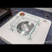Modern glass coffee table with metal burner and Elementi logo
